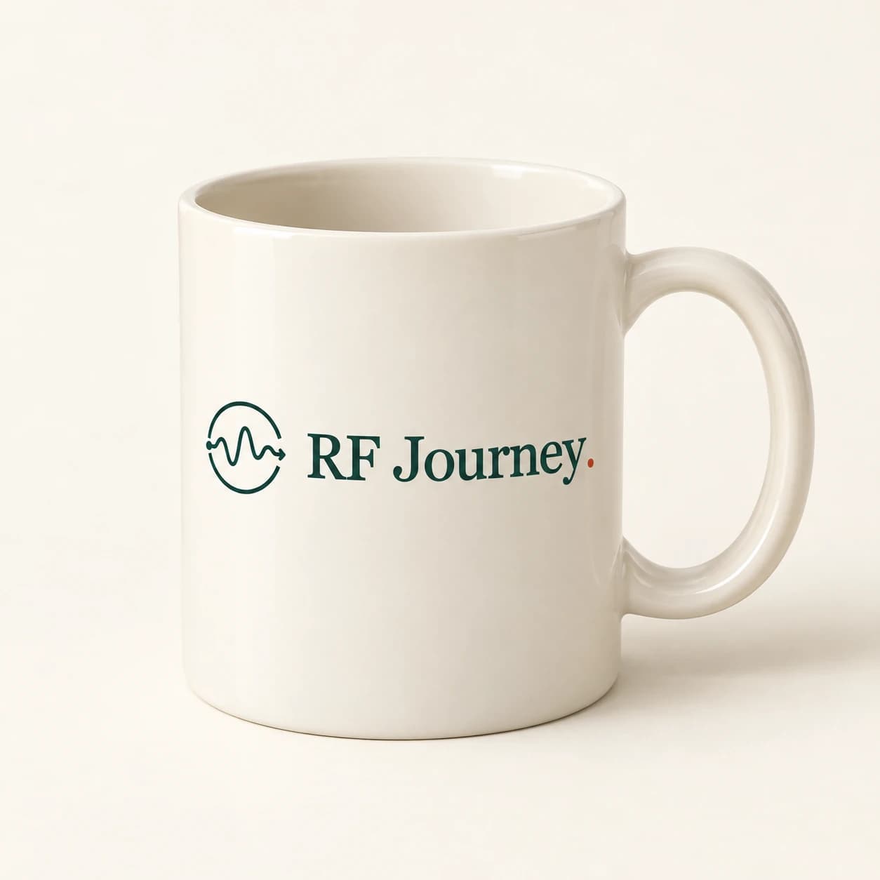Concept mockup of a cream ceramic mug carrying the forest green RF Journey logo and copper wordmark dot.